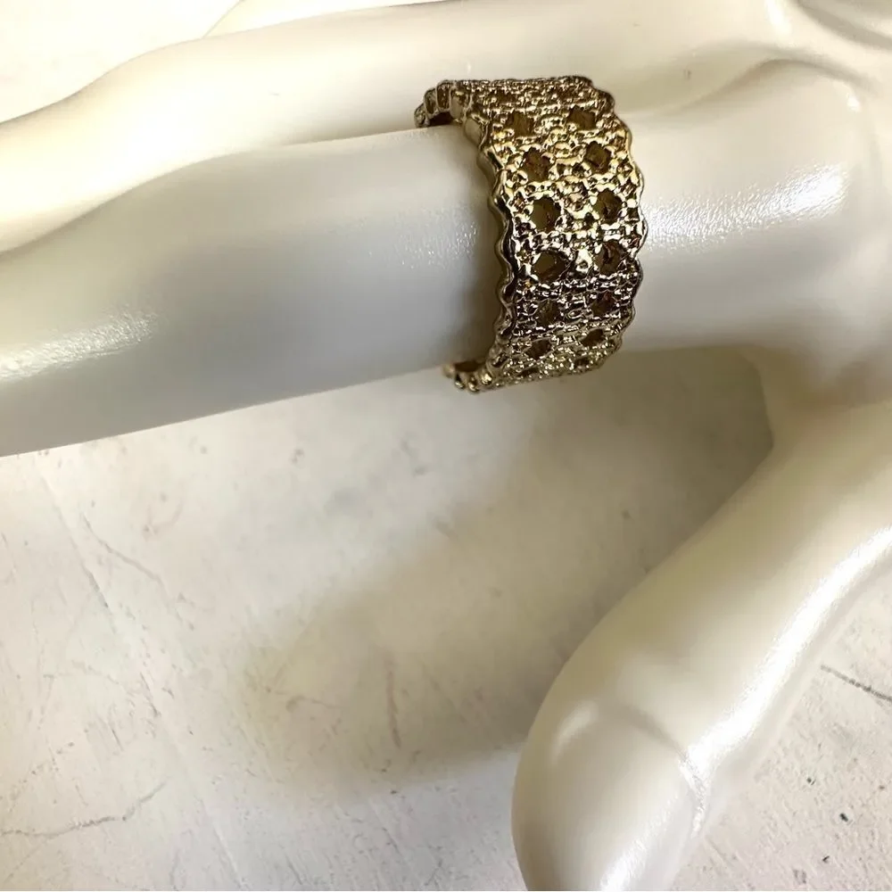 Gold tone band ring gold tone